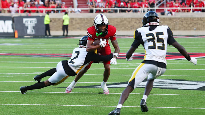 Aug 30, 2025; Lubbock, Texas, USA;  Texas Tech Red Raiders wide receiver Reggie Virgil (1) rushes against Arkansas-Pine Bluff Golden Lions defensive back Kristian Gammage (2) in the first half at Jones AT&T Stadium. Mandatory Credit: Michael C. Johnson-Imagn Images