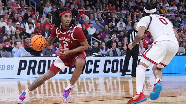 Mar 22, 2025; Providence, RI, USA; Arkansas Razorbacks guard Boogie Fland (2) dribbles against St. John's Red Storm guard Aaron Scott (0) during the second half of a second round men’s NCAA Tournament game at Amica Mutual Pavilion. Mandatory Credit: Gregory Fisher-Imagn Images
