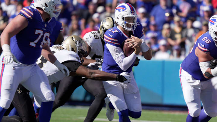 Bills quarterback Josh Allen carries the ball against the Saints.