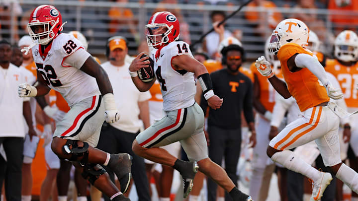 Sep 13, 2025; Knoxville, Tennessee, USA; Georgia Bulldogs quarterback Gunner Stockton (14) runs the ball during the second half against Tennessee Volunteers at Neyland Stadium. Mandatory Credit: Alan Poizner-Imagn Images Sep 13, 2025; Knoxville, Tennessee, USA; Georgia Bulldogs quarterback Gunner Stockton (14) runs the ball during the second half against Tennessee Volunteers at Neyland Stadium. Mandatory Credit: Alan Poizner-Imagn Images