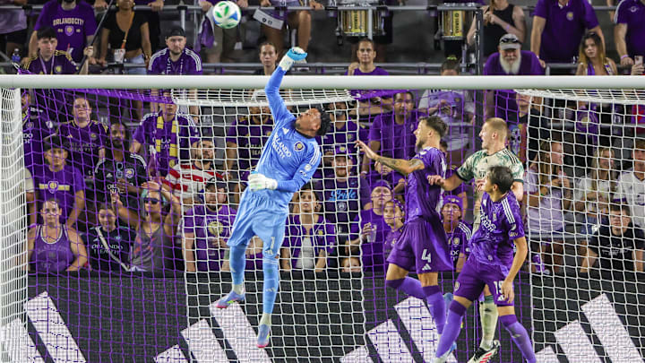 May 24, 2025; Orlando, Florida, USA; Orlando City goalkeeper Pedro Gallese (1) blocks a shot during the second half against the Portland Timbers at Inter&Co Stadium. Mandatory Credit: Mike Watters-Imagn Images