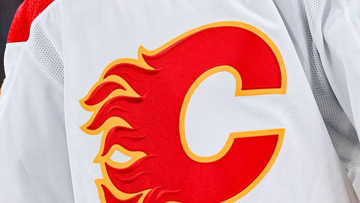 Dec 12, 2022; Montreal, Quebec, CAN; View of a Calgary Flames logo on a jersey worn by the member of the team during the second period at Bell Centre. Mandatory Credit: David Kirouac-Imagn Images