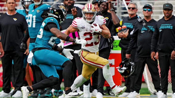 Sep 28, 2025; Santa Clara, California, USA; San Francisco 49ers running back Christian McCaffrey (23) runs after a catch against Jacksonville Jaguars linebacker Yasir Abdullah (56) during the second half at Levi's Stadium. Mandatory Credit: Darren Yamashita-Imagn Images Sep 28, 2025; Santa Clara, California, USA; San Francisco 49ers running back Christian McCaffrey (23) runs after a catch against Jacksonville Jaguars linebacker Yasir Abdullah (56) during the second half at Levi's Stadium. Mandatory Credit: Darren Yamashita-Imagn Images