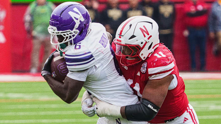 Northwestern Wildcats running back Joseph Himon II runs with the ball against Nebraska Cornhuskers defensive lineman Cameron Lenhardt during the fourth quarter. Northwestern Wildcats running back Joseph Himon II runs with the ball against Nebraska Cornhuskers defensive lineman Cameron Lenhardt during the fourth quarter.