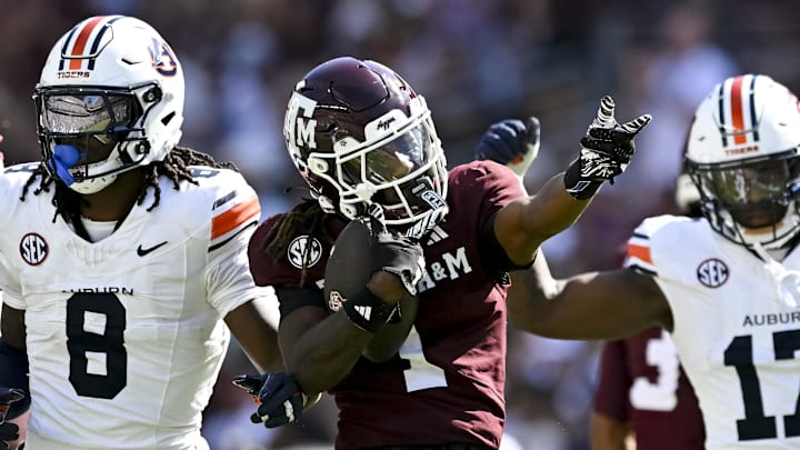 Sep 27, 2025; College Station, Texas, USA; Texas A&M Aggies wide receiver Mario Craver (1) motions against the Auburn Tigers during the first half at Kyle Field. Mandatory Credit: Maria Lysaker-Imagn Images 