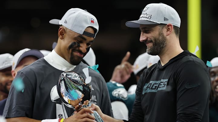 Feb 9, 2025; New Orleans, LA, USA; Philadelphia Eagles quarterback Jalen Hurts holds the Lombardi Trophy while standing next to Eagles head coach Nick Sirianni (R) during the championship trophy presentation after the Eagles' game against the Kansas City Chiefs in Super Bowl LIX at Caesars Superdome. Mandatory Credit: Geoff Burke-Imagn Images Feb 9, 2025; New Orleans, LA, USA; Philadelphia Eagles quarterback Jalen Hurts holds the Lombardi Trophy while standing next to Eagles head coach Nick Sirianni (R) during the championship trophy presentation after the Eagles' game against the Kansas City Chiefs in Super Bowl LIX at Caesars Superdome. Mandatory Credit: Geoff Burke-Imagn Images