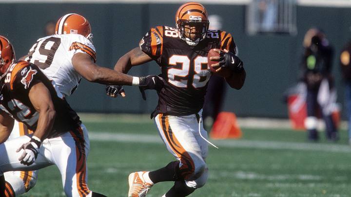 Oct 14, 2001; Cincinnati, OH, USA; Cincinnati Bengals running back Corey Dillon (28) runs with the ball during the game against the Cleveland Browns at Paul Brown Stadium. The Bengals beat the Browns 24-14. Mandatory Credit: Matthew Emmons-USA TODAY Sports