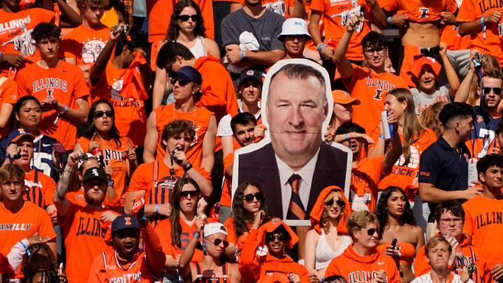 Illinois students hold a cutout of Illinois head coach Bret Bielema during the second half of the NCAA football game at Gies Memorial Stadium in Champaign on Oct. 11, 2025. Ohio State won 34-16. Illinois students hold a cutout of Illinois head coach Bret Bielema during the second half of the NCAA football game at Gies Memorial Stadium in Champaign on Oct. 11, 2025. Ohio State won 34-16.