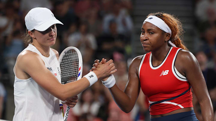 Iga Swiatek and Coco Gauff shake hands after their match at the United Cup.