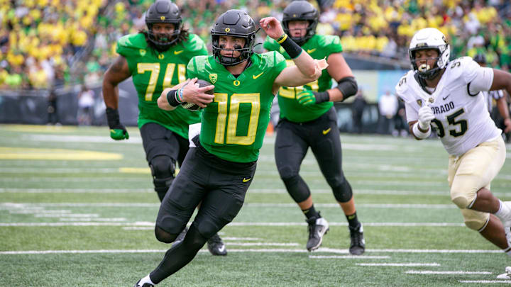 Oregon quarterback Bo Nix runs for a touchdown as the Oregon Ducks host Colorado in the Pac-12
