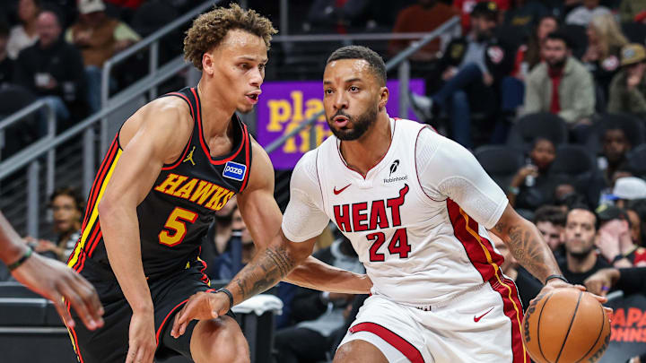 Dec 26, 2025; Atlanta, Georgia, USA; Miami Heat guard Norman Powell (24) dribbles the ball towards the goal against Atlanta Hawks guard Dyson Daniels (5) during the first quarter at State Farm Arena. Mandatory Credit: Jordan Godfree-Imagn Images Dec 26, 2025; Atlanta, Georgia, USA; Miami Heat guard Norman Powell (24) dribbles the ball towards the goal against Atlanta Hawks guard Dyson Daniels (5) during the first quarter at State Farm Arena. Mandatory Credit: Jordan Godfree-Imagn Images