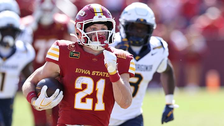 Oct 3, 2026; Ames, Iowa, USA;  Iowa State Cyclones running back Aiden Flora (21) breaks through the West Virginia Mountaineers defense for a touchdown during the second half at Jack Trice Stadium.  Mandatory Credit: Reese Strickland-Imagn Images