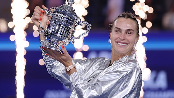 Aryna Sabalenka holds aloft the U.S. Open trophy after the tournament final.