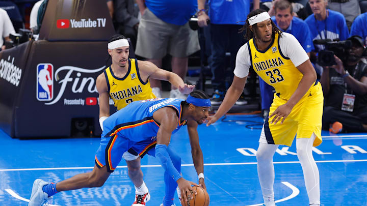 Jun 22, 2025; Oklahoma City, Oklahoma, USA; Oklahoma City Thunder guard Shai Gilgeous-Alexander (2) controls the ball while Indiana Pacers center Myles Turner (33) defends during the second half of game seven of the 2025 NBA Finals at Paycom Center. Mandatory Credit: Alonzo Adams-Imagn Images