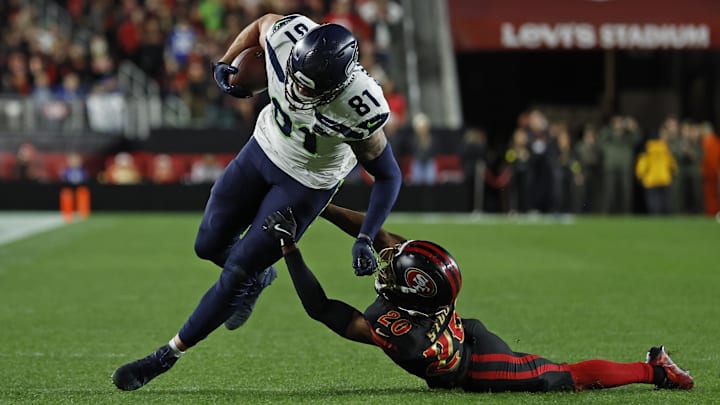Jan 3, 2026; Santa Clara, California, USA; Seattle Seahawks tight end Eric Saubert (81) makes a catch against San Francisco 49ers cornerback Upton Stout (20) during the second half at Levi's Stadium. Mandatory Credit: Sergio Estrada-Imagn Images