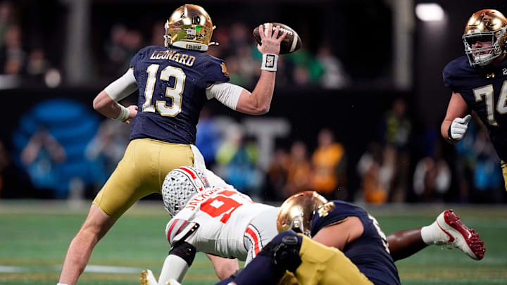 Notre Dame Fighting Irish quarterback Riley Leonard (13) throws the ball against Ohio State Buckeyes defensive end Kenyatta Jackson Jr. (97) in the third quarter during the College Football Playoff championship at Mercedes-Benz Stadium in Atlanta on January 20, 2025. Notre Dame Fighting Irish quarterback Riley Leonard (13) throws the ball against Ohio State Buckeyes defensive end Kenyatta Jackson Jr. (97) in the third quarter during the College Football Playoff championship at Mercedes-Benz Stadium in Atlanta on January 20, 2025.