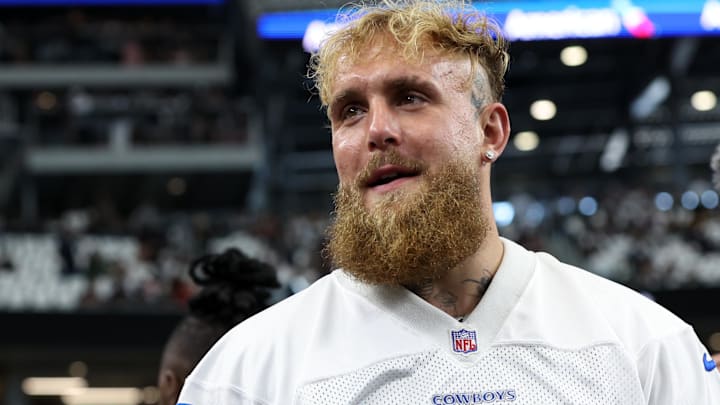 Sep 15, 2024; Arlington, Texas, USA; Boxer and influencer Jake Paul walks on the field before a game between the New Orleans Saints and Dallas Cowboys at AT&T Stadium.