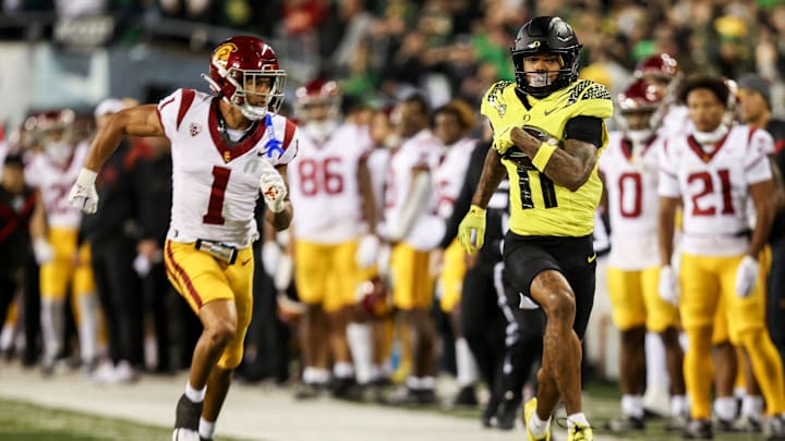 Oregon Ducks wide receiver Troy Franklin (11) carries the ball after receiving a pass during the first half of the game against the USC Trojans on Saturday, Nov. 11, 2023, at Autzen Stadium in Eugene, Ore.