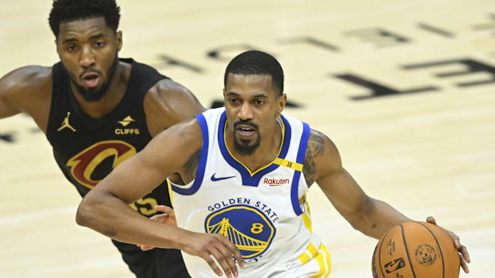 Nov 8, 2024; Cleveland, Ohio, USA; Golden State Warriors guard De'Anthony Melton (8) drives beside Cleveland Cavaliers guard Donovan Mitchell (45) in the fourth quarter at Rocket Mortgage FieldHouse. Mandatory Credit: David Richard-Imagn Images