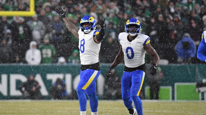 Jan 19, 2025; Philadelphia, Pennsylvania, USA; Los Angeles Rams linebacker Jared Verse (8) and linebacker Byron Young (0) celebrate a sack against the Philadelphia Eagles in a 2025 NFC divisional round game at Lincoln Financial Field. Mandatory Credit: Eric Hartline-Imagn Images