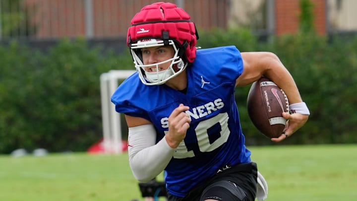 Oklahoma quarterback John Mateer runs the ball at one of the Sooners' fall camp practices.