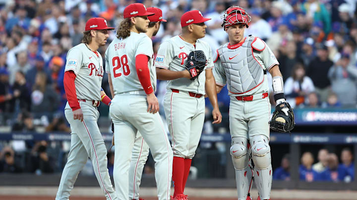 Oct 9, 2024; New York, New York, USA; Philadelphia Phillies pitcher Ranger Suarez (55) meets with teammates on the mound against the New York Mets in game four of the NLDS for the 2024 MLB Playoffs at Citi Field.