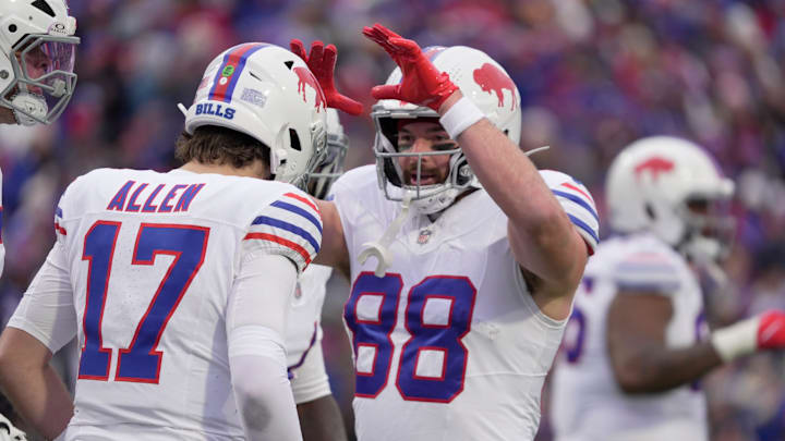 Buffalo Bills tight end Dawson Knox high fives Buffalo Bills quarterback Josh Allen who just scored on a two-yard touchdown run during first half action against the Tampa Bay Buccaneers on Nov 16, 2025 at Highmark Stadium in Orchard Park.