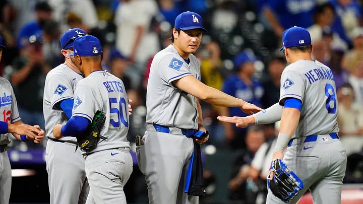 Aug 19, 2026; Denver, Colorado, USA; Los Angeles Dodgers shortstop Mookie Betts (50) and designated hitter Shohei Ohtani (17) and first baseman Enrique Hernandez (8) celebrate the tenth inning win against the Colorado Rockies at Coors Field. Mandatory Credit: Ron Chenoy-Imagn Images Aug 19, 2026; Denver, Colorado, USA; Los Angeles Dodgers shortstop Mookie Betts (50) and designated hitter Shohei Ohtani (17) and first baseman Enrique Hernandez (8) celebrate the tenth inning win against the Colorado Rockies at Coors Field. Mandatory Credit: Ron Chenoy-Imagn Images