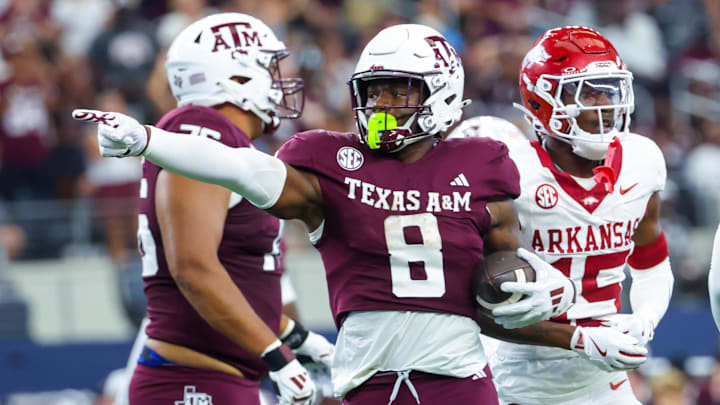 Sep 28, 2024; Arlington, Texas, USA; Texas A&M Aggies running back Le'Veon Moss (8) reacts during the second half against the Arkansas Razorbacks at AT&T Stadium. Mandatory Credit: Kevin Jairaj-Imagn Images Sep 28, 2024; Arlington, Texas, USA; Texas A&M Aggies running back Le'Veon Moss (8) reacts during the second half against the Arkansas Razorbacks at AT&T Stadium. Mandatory Credit: Kevin Jairaj-Imagn Images