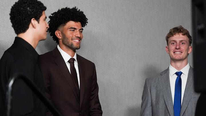 Grizzlies 2026 NBA Draft picks Karim Lopez, Cam Boozer and Richie Saunders laugh with each other after their introductory press conference at FedExForum in Memphis, Tenn., on June 25, 2026.