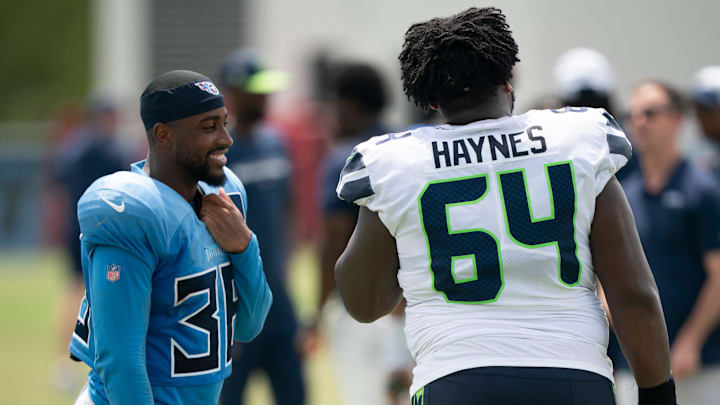 Tennessee Titans running back Julius Chestnut (36) and Seattle Seahawks guard Christian Haynes (64) talk after practice at Ascension Saint Thomas Sports Park in Nashville, Tenn., Wednesday, Aug. 14, 2024.