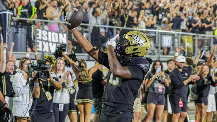 Nov 22, 2025; Orlando, Florida, USA; UCF Knights tight end Dylan Wade (0) reacts after scoring during the second half against the Oklahoma State Cowboys at Acrisure Bounce House. Mandatory Credit: Mike Watters-Imagn Images Nov 22, 2025; Orlando, Florida, USA; UCF Knights tight end Dylan Wade (0) reacts after scoring during the second half against the Oklahoma State Cowboys at Acrisure Bounce House. Mandatory Credit: Mike Watters-Imagn Images