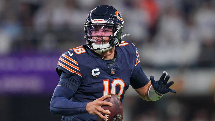 Chicago Bears quarterback Caleb Williams (18) scrambles against the Minnesota Vikings. Chicago Bears quarterback Caleb Williams (18) scrambles against the Minnesota Vikings.