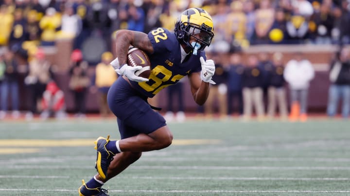 Nov 25, 2023; Ann Arbor, Michigan, USA; Michigan Wolverines wide receiver Semaj Morgan (82) runs the ball in the second half against the Ohio State Buckeyes at Michigan Stadium. Nov 25, 2023; Ann Arbor, Michigan, USA; Michigan Wolverines wide receiver Semaj Morgan (82) runs the ball in the second half against the Ohio State Buckeyes at Michigan Stadium.