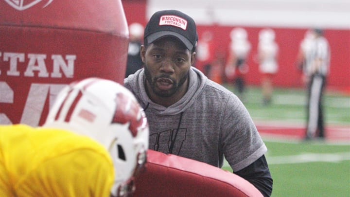 Wisconsin Badgers quarterbacks coach Kenny Guiton works with a player during a drill during practice at the McClain Center in Madison, Wisconsin.