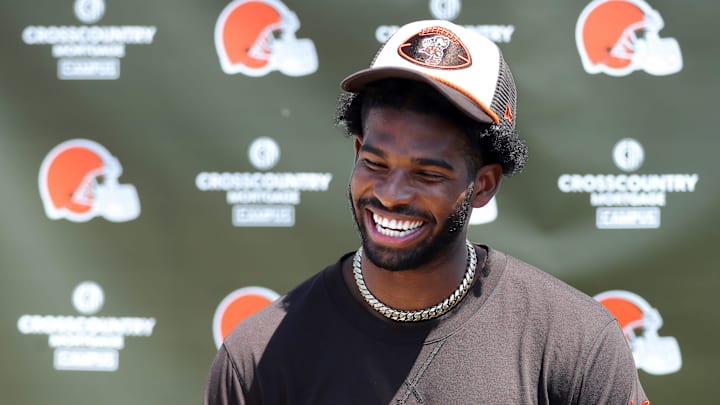 Cleveland Browns quarterback Shedeur Sanders (12) jokes about his signing bonus during a press conference before day two of NFL rookie minicamp at the Cleveland Browns training facility on Saturday, May 10, 2025, in Berea, Ohio.