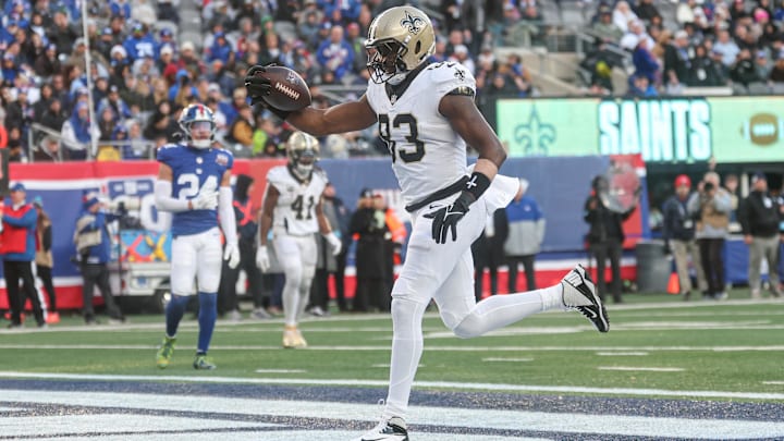 Dec 8, 2024; East Rutherford, New Jersey, USA; New Orleans Saints tight end Juwan Johnson (83) catches the ball a touchdown pass during the second half against the New York Giants at MetLife Stadium. 
