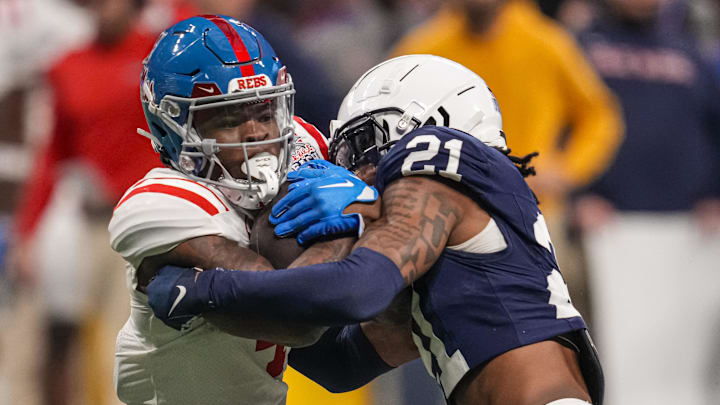 Mississippi Rebels running back Quinshon Judkins is tackled by Penn State Nittany Lions safety Kevin Winston Jr.. Mandatory Credit: Dale Zanine-Imagn Images