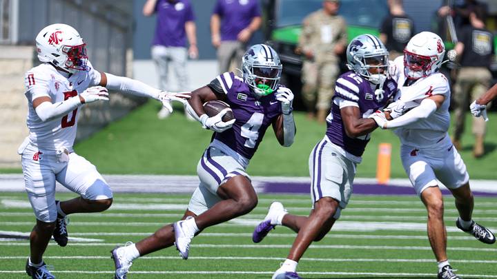 Sep 12, 2026; Manhattan, Kansas, USA; Kansas State Wildcats running back Joe Jackson (4) runs by Washington State Cougars cornerback CJ Solis-Lumar (0) during the third quarter at Bill Snyder Family Football Stadium. Mandatory Credit: Scott Sewell-Imagn Images Sep 12, 2026; Manhattan, Kansas, USA; Kansas State Wildcats running back Joe Jackson (4) runs by Washington State Cougars cornerback CJ Solis-Lumar (0) during the third quarter at Bill Snyder Family Football Stadium. Mandatory Credit: Scott Sewell-Imagn Images