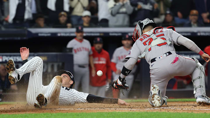 Oct 2, 2025; Bronx, New York, USA; New York Yankees outfielder Cody Bellinger (35) slides into home plate to score as Boston Red Sox catcher Carlos Narváez (75) cannot handle the throw in the fourth inning during game three of the Wildcard round for the 2025 MLB playoffs at Yankee Stadium. Mandatory Credit: Vincent Carchietta-Imagn Images Oct 2, 2025; Bronx, New York, USA; New York Yankees outfielder Cody Bellinger (35) slides into home plate to score as Boston Red Sox catcher Carlos Narváez (75) cannot handle the throw in the fourth inning during game three of the Wildcard round for the 2025 MLB playoffs at Yankee Stadium. Mandatory Credit: Vincent Carchietta-Imagn Images