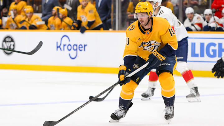 Feb 25, 2025; Nashville, Tennessee, USA;  Nashville Predators center Colton Sissons (10) skates with the puck against the Florida Panthers during the third period at Bridgestone Arena. Mandatory Credit: Steve Roberts-Imagn Images