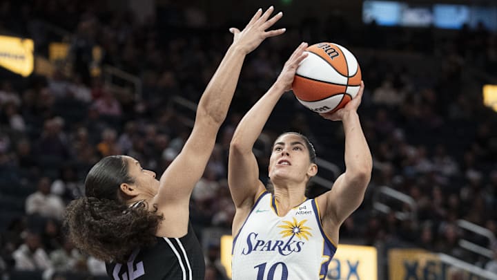 May 6, 2025; San Francisco, CA, USA; Los Angeles Sparks guard Kelsey Plum (10) shoots the basketball against Golden State Valkyries guard Veronica Burton (22) during the third quarter at Chase Center. Mandatory Credit: Kyle Terada-Imagn Images