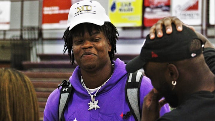 Five-star defensive lineman prospect Williams Nwaneri smiles after his commitment ceremony on August 14, 2023, in Lee's Summit, Mo.