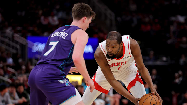 Feb 5, 2026; Houston, Texas, USA; Houston Rockets forward Kevin Durant (7) handles the ball against Charlotte Hornets guard Kon Knueppel (7) during the third quarter at Toyota Center. Mandatory Credit: Erik Williams-Imagn Images