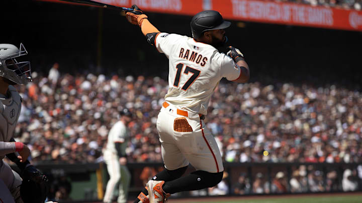 Jun 22, 2025; San Francisco, California, USA; San Francisco Giants left fielder Heliot Ramos (17) follows through on his two-RBI double against the Boston Red Sox during the seventh inning at Oracle Park. Mandatory Credit: D. Ross Cameron-Imagn Images