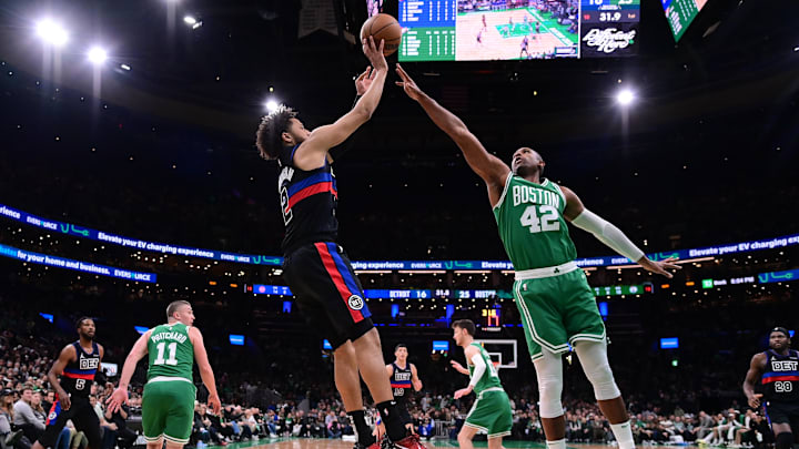 Dec 12, 2024; Boston, Massachusetts, USA; Boston Celtics center Al Horford (42) defends against Detroit Pistons guard Cade Cunningham (2) during the first half at TD Garden. Mandatory Credit: Eric Canha-Imagn Images
