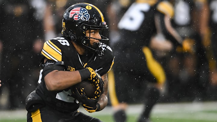 Nov 8, 2025; Iowa City, Iowa, USA; Iowa Hawkeyes running back Kamari Moulton (28) runs the ball during the first quarter against the Oregon Ducks at Kinnick Stadium. Mandatory Credit: Jeffrey Becker-Imagn Images