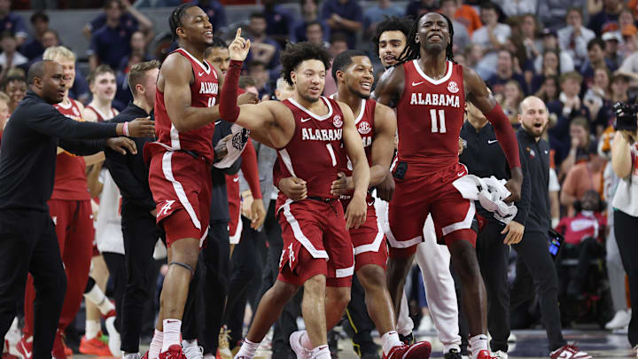 Mar 8, 2025; Auburn, Alabama, USA; Alabama Crimson Tide guard Mark Sears (1) celebrates after making the game winning shot to beat the Auburn Tigers in overtime at Neville Arena. Mandatory Credit: John Reed-Imagn Images