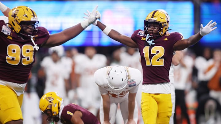 Jan 1, 2025; Atlanta, GA, USA; Arizona State Sun Devils defensive lineman C.J. Fite (99) and defensive back Javan Robinson (12) react after a play against the Texas Longhorns during the second half of the Peach Bowl at Mercedes-Benz Stadium. Mandatory Credit: Brett Davis-Imagn Images