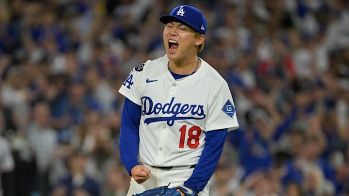 Oct 1, 2025; Los Angeles, California, USA; Los Angeles Dodgers starting pitcher Yoshinobu Yamamoto (18) celebrates after throwing against the Cincinnati Reds in the sixth inning during game two of the Wildcard round for the 2025 MLB playoffs at Dodger Stadium. Mandatory Credit: Jayne Kamin-Oncea-Imagn Images